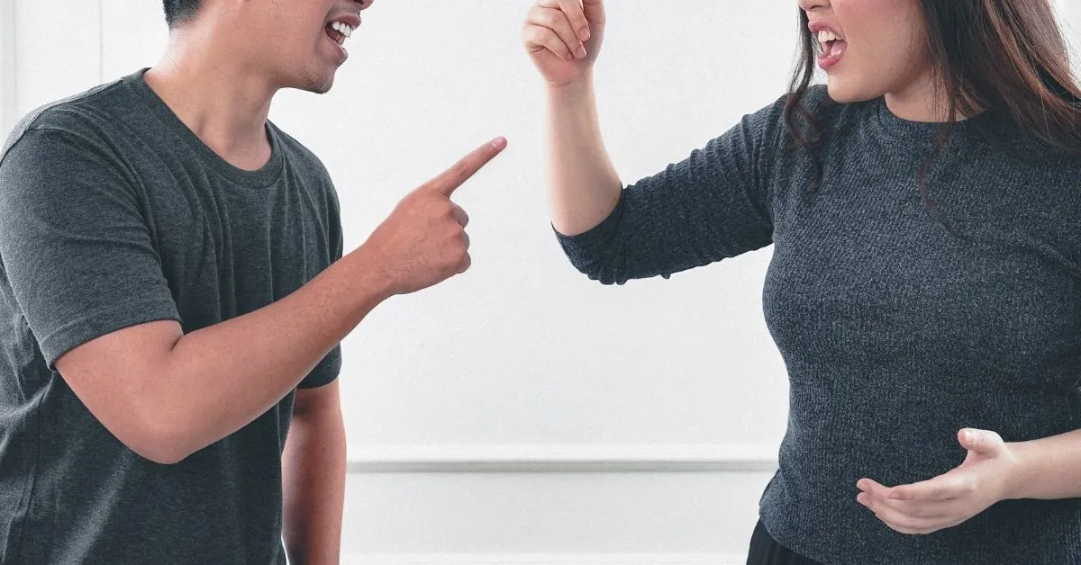spouse in a heated argument as wife gets angry and refuses to answer when questioned